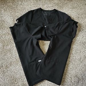 Lot of 2 Black Casma Figs tops in size medium.